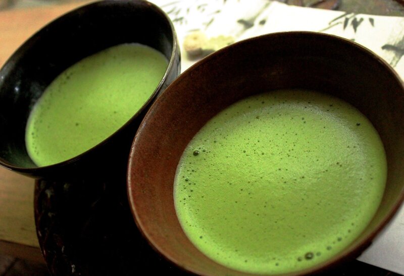 Two bowls of matcha green tea