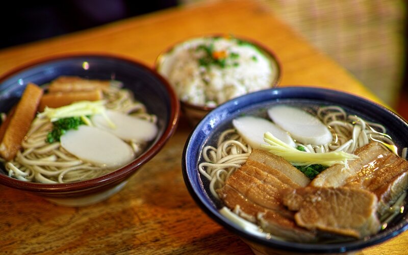 Two bowls of ramen with rice