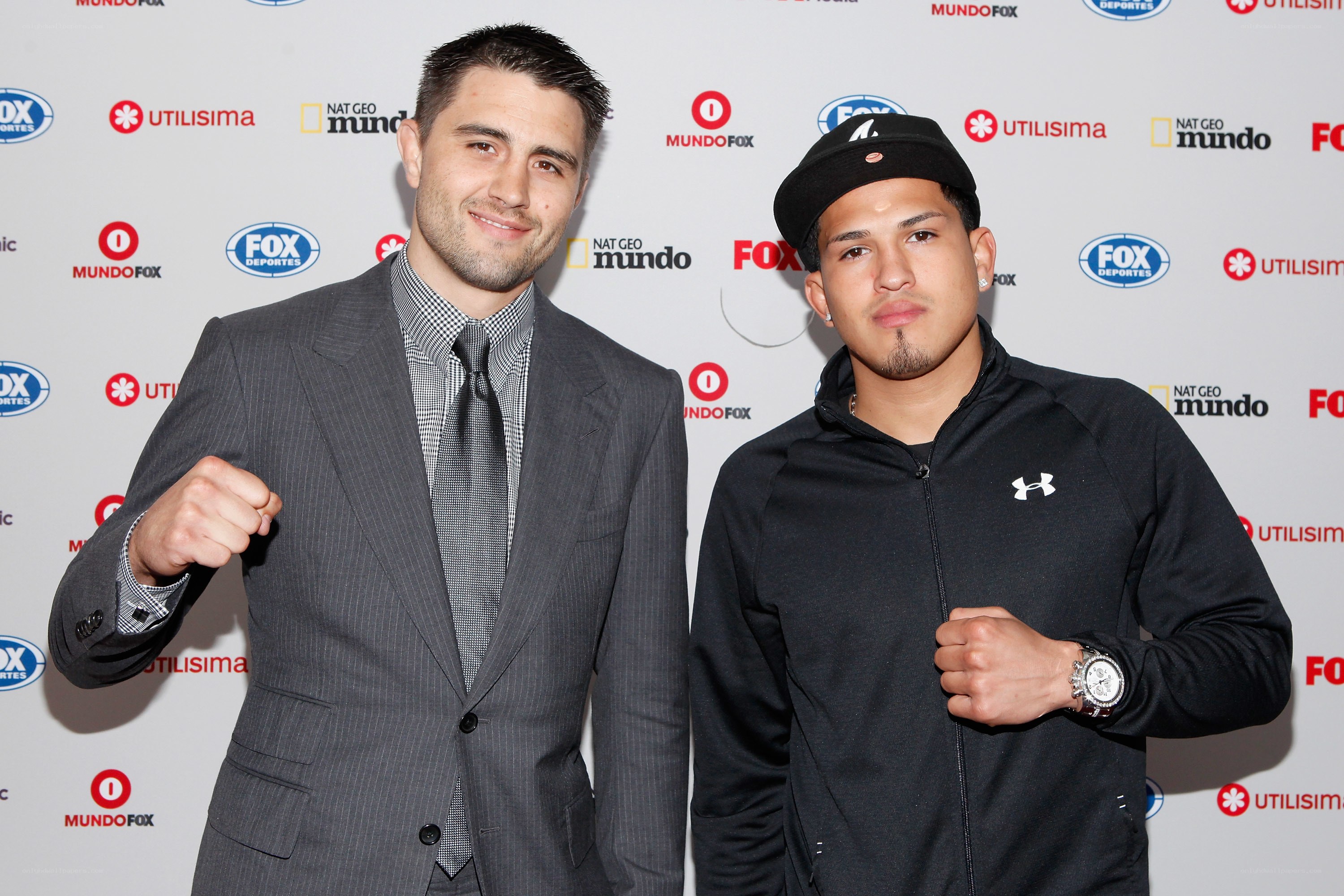 Two boxers pose at event