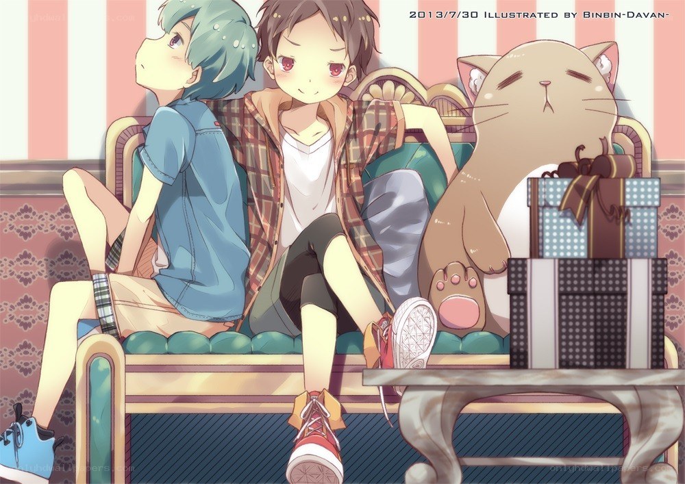 Two boys and a cat on a couch