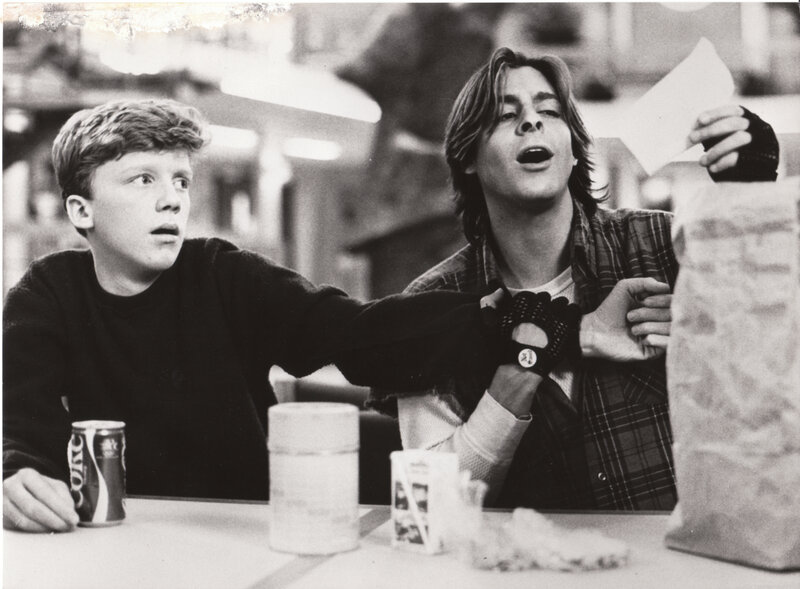 Two boys at a table with food