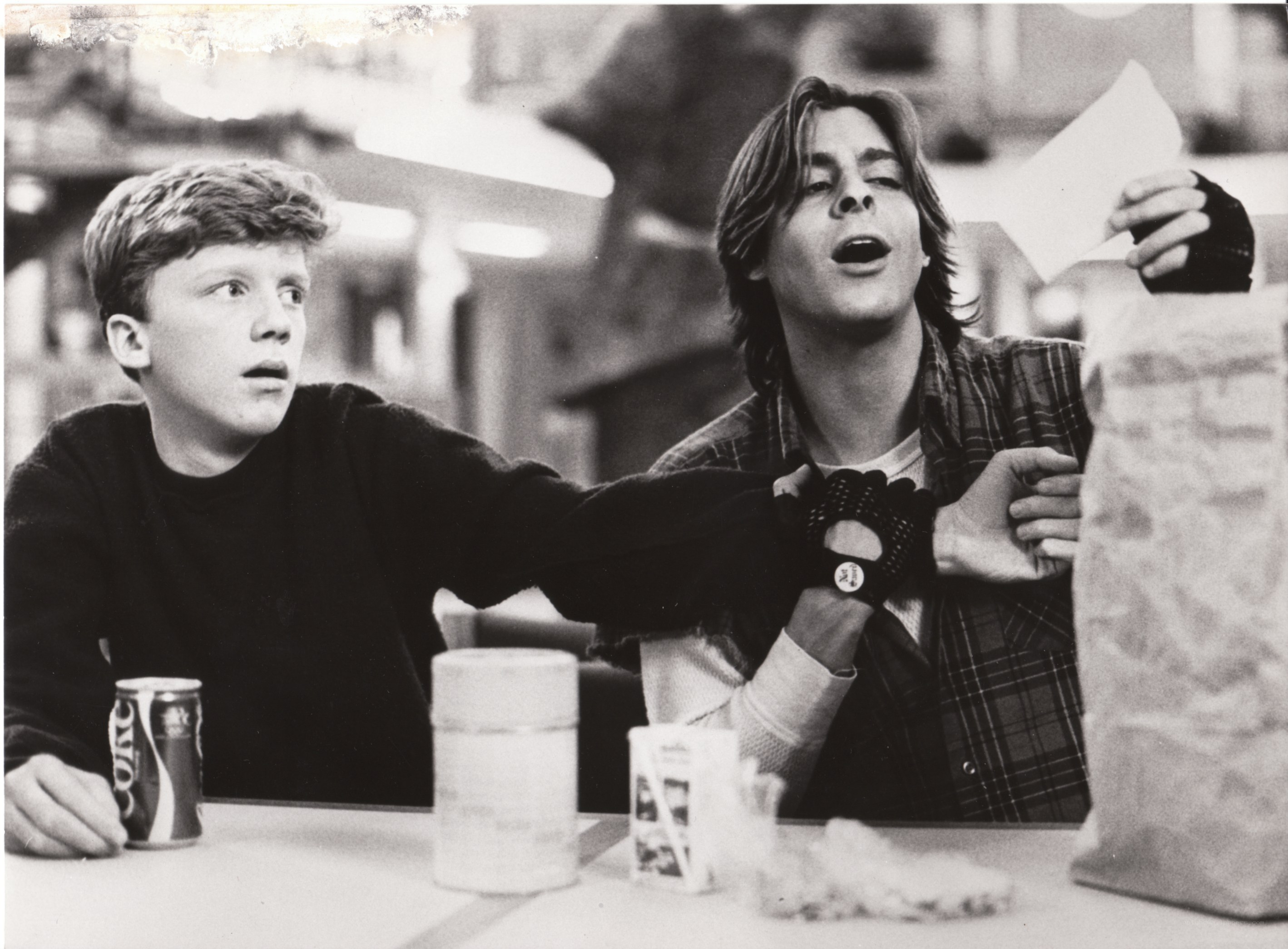 Two boys at a table with food