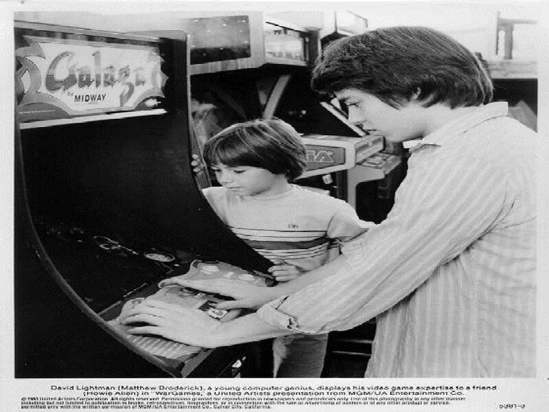 Two Boys at Arcade Game