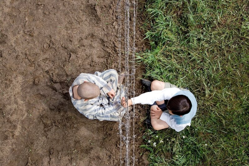 Two Boys at Barbed Wire