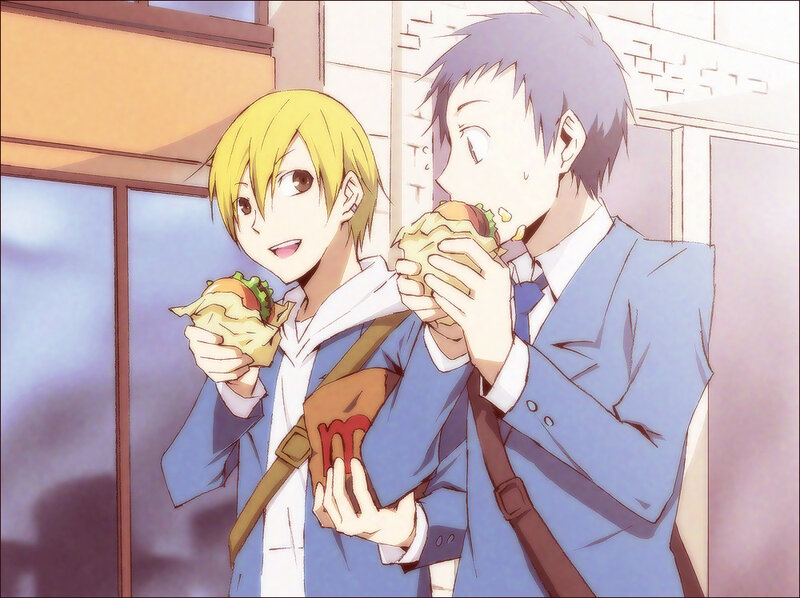 two boys eating burgers