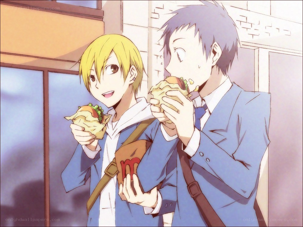 two boys eating burgers