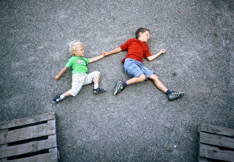 Two Boys Holding Hands — Gray