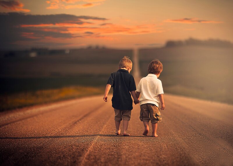 Two Boys Holding Hands — Orange