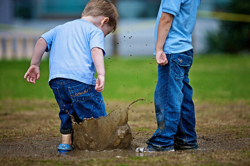 Two Boys in Mud Puddle
