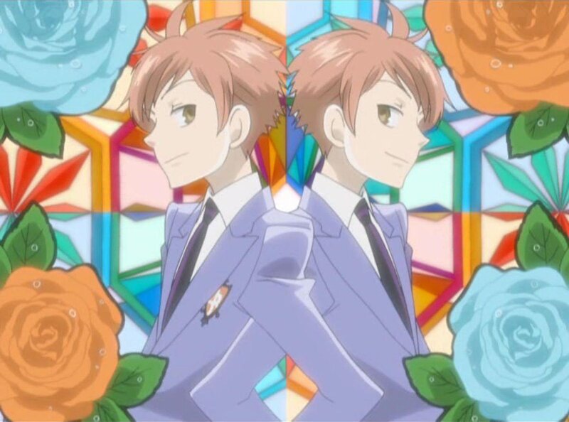 two boys in suits with roses