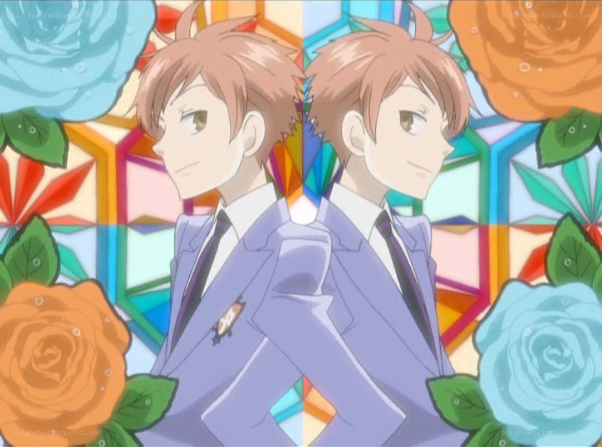 two boys in suits with roses