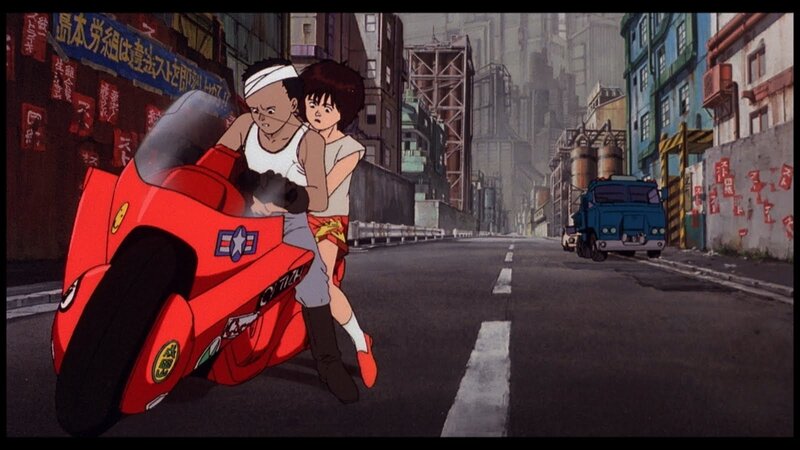 Two boys on a red motorcycle