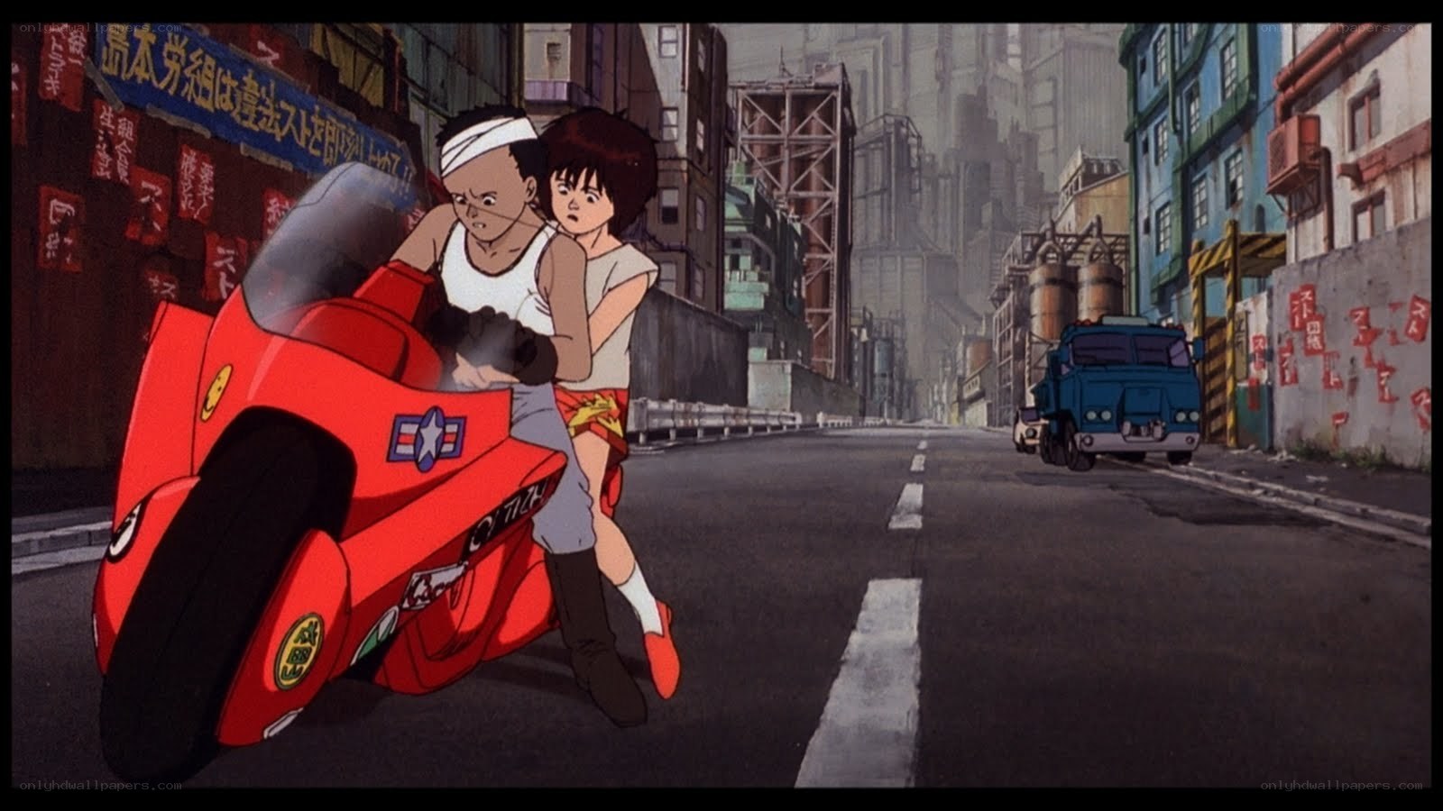 Two boys on a red motorcycle