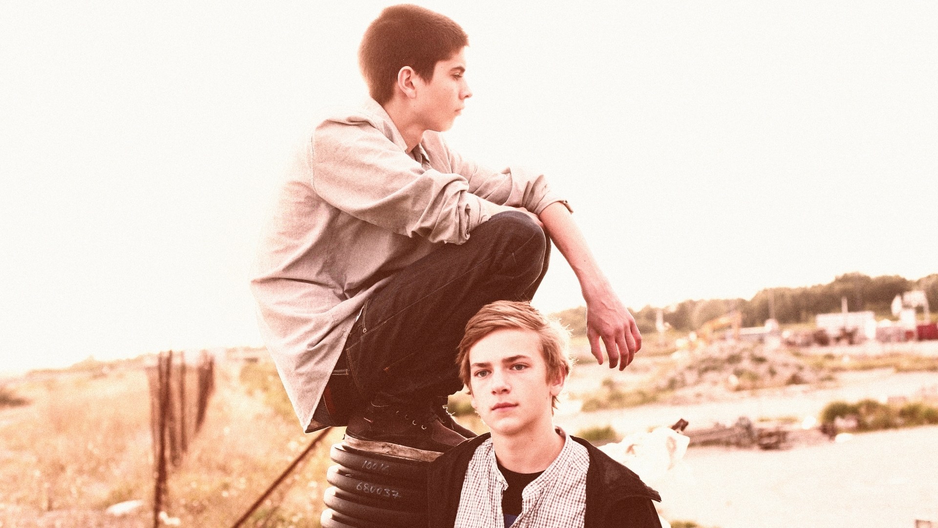 Two boys on a tire
