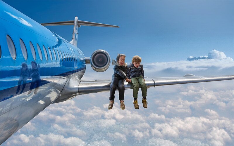 Two Boys on Airplane Wing