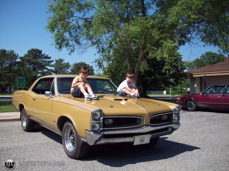 Two Boys on Car Hood