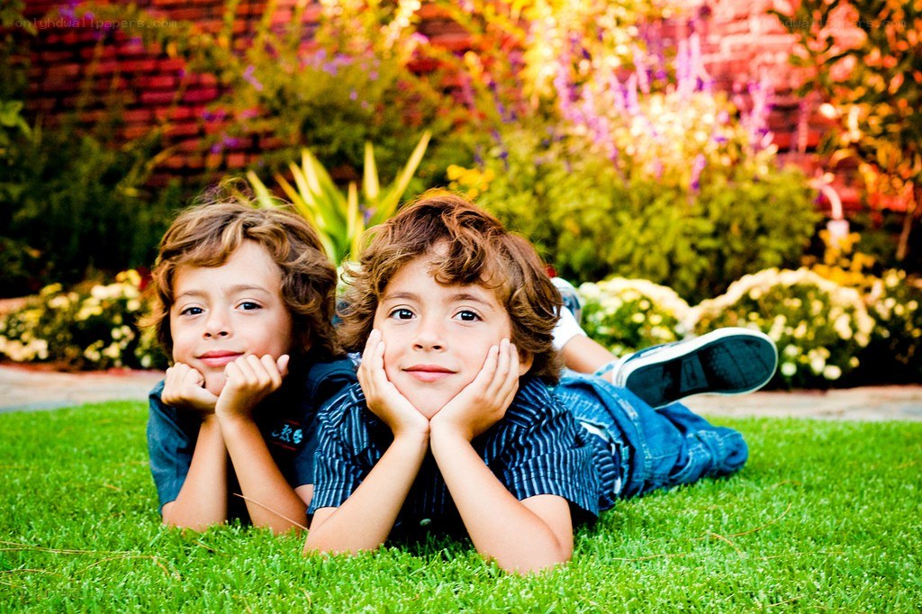 two boys on grass in garden
