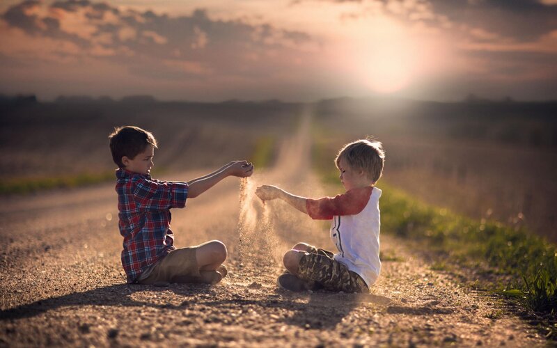 Two Boys Playing with Sand