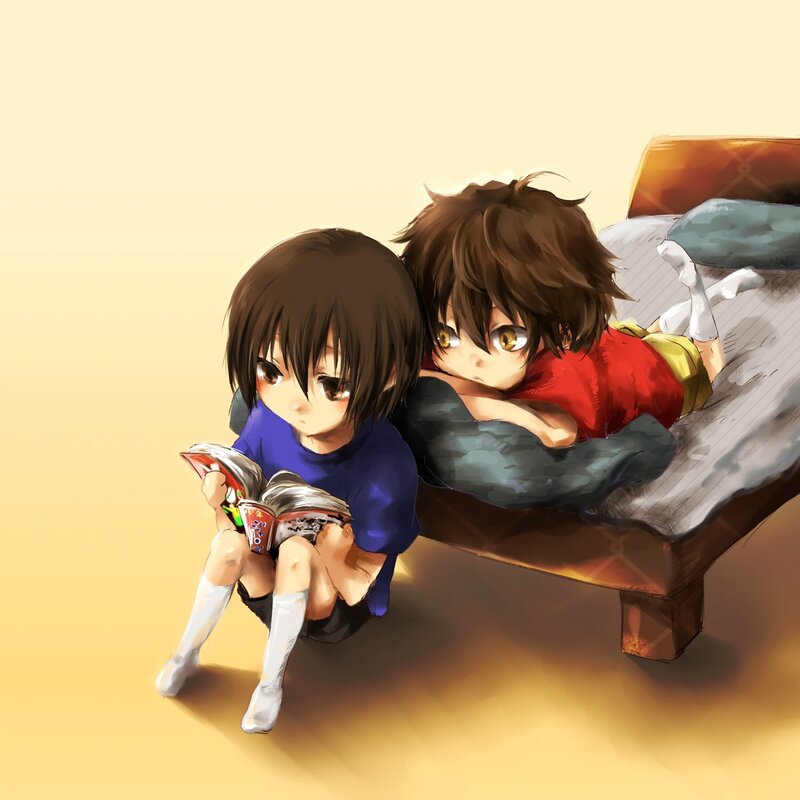 Two boys reading together