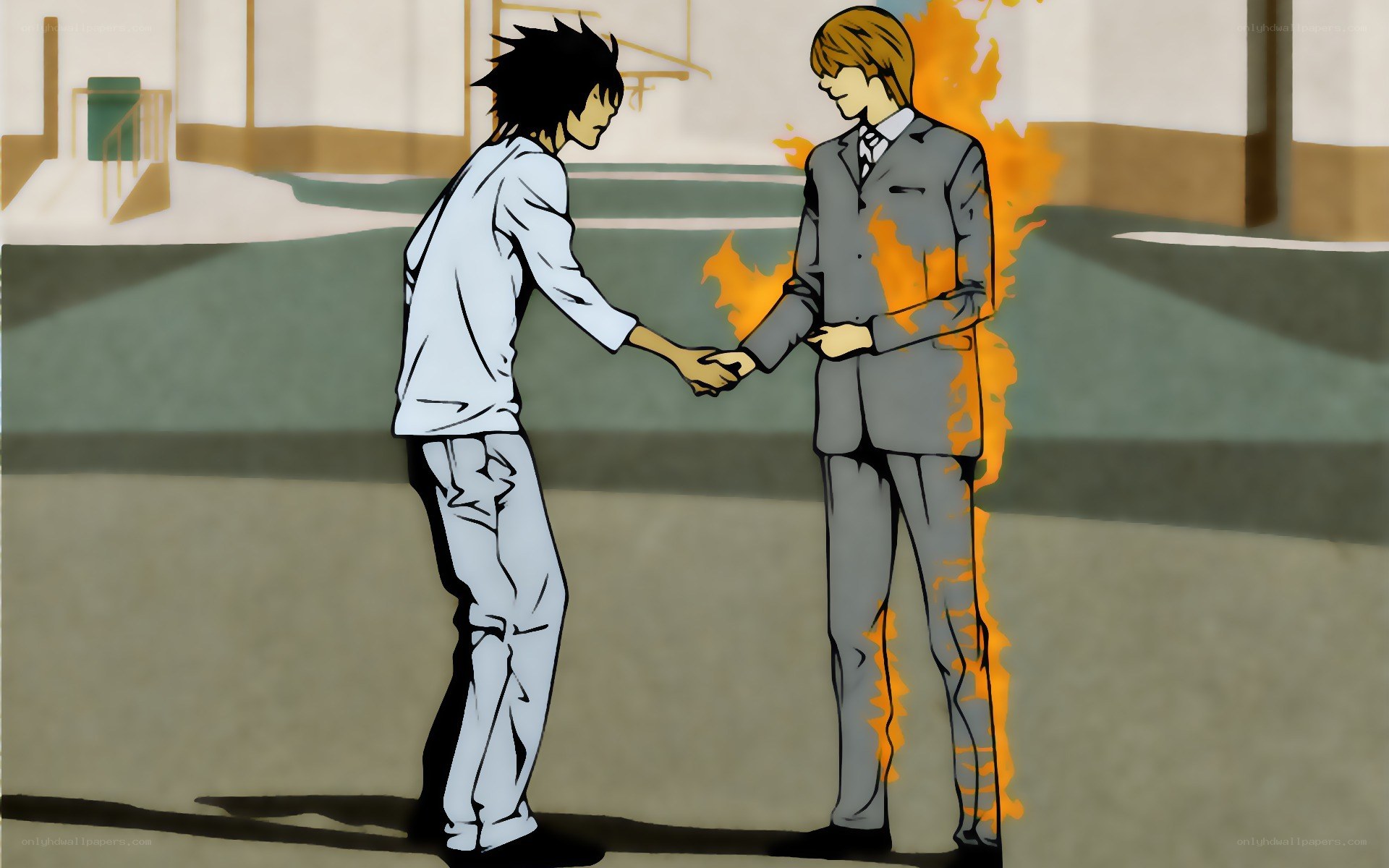 Two boys shaking hands in a school