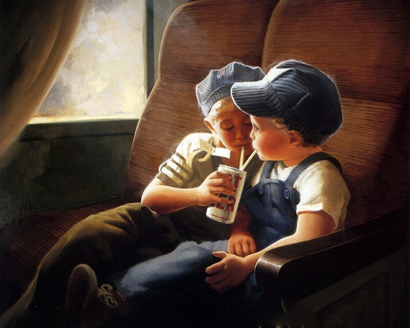 Two boys sharing a drink