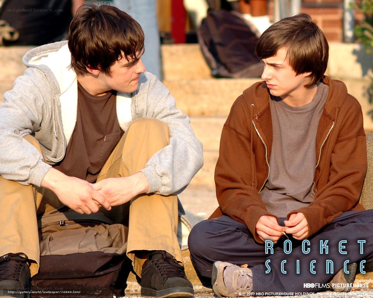 two boys sitting on steps