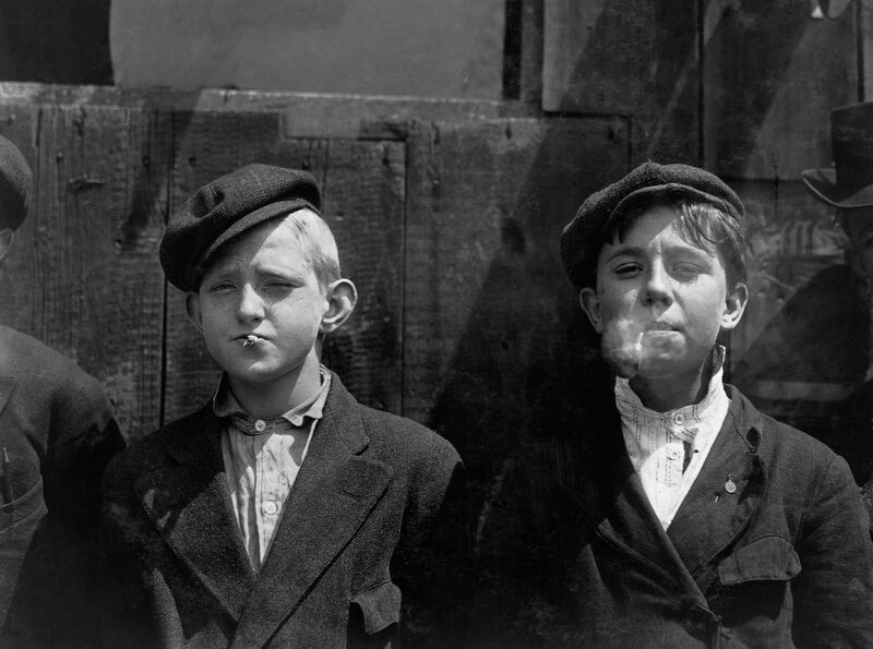 Two boys smoking cigarettes