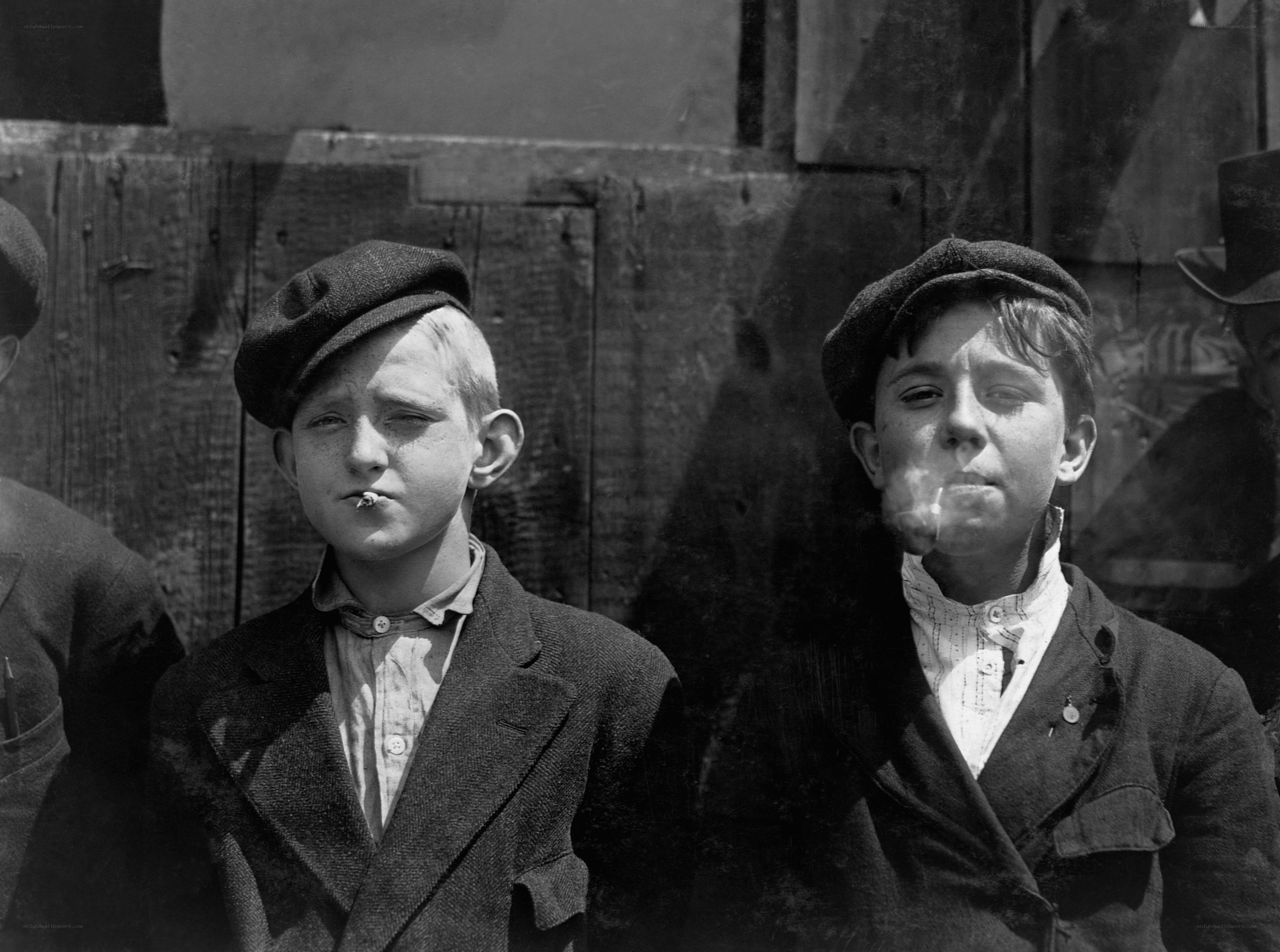 Two boys smoking cigarettes