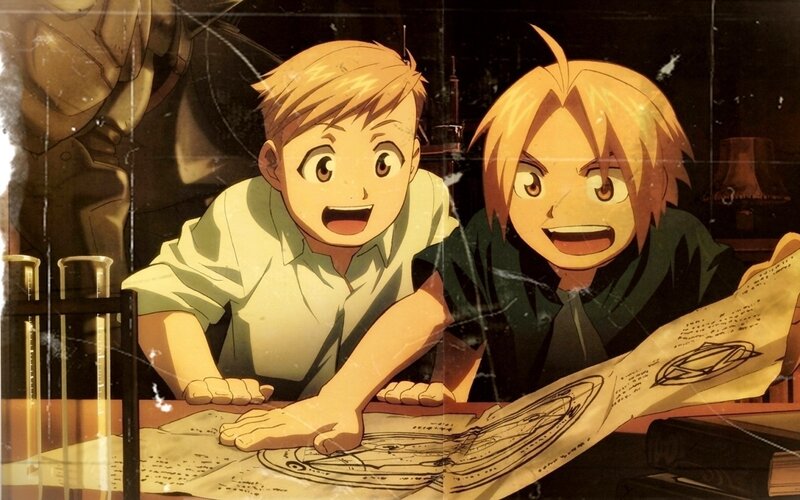 Two Boys Studying Blueprints