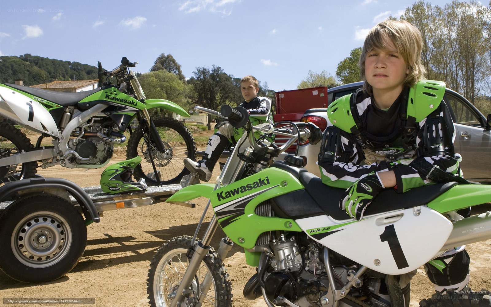 Two boys with motocross bikes
