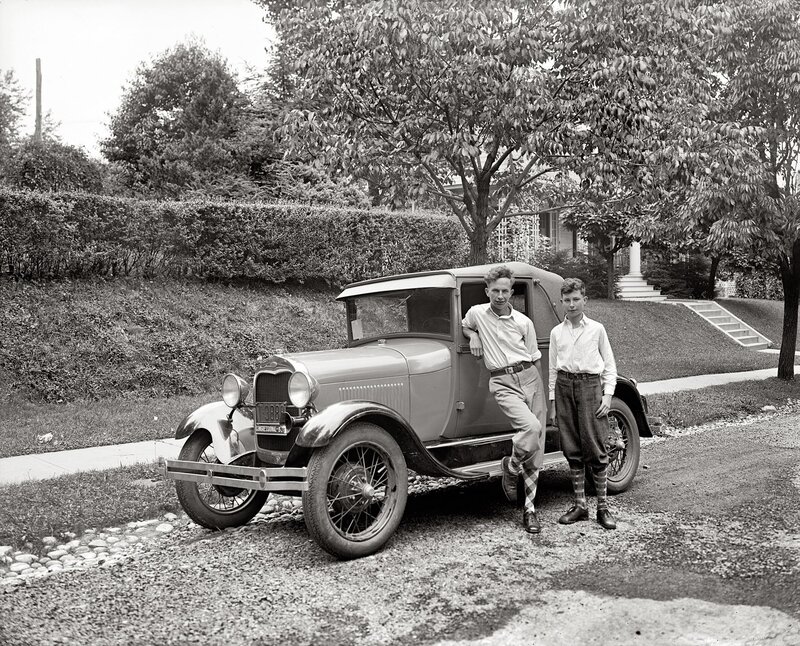 Two boys with vintage car