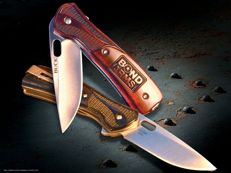 Two Buck Knives on Rusty Surface