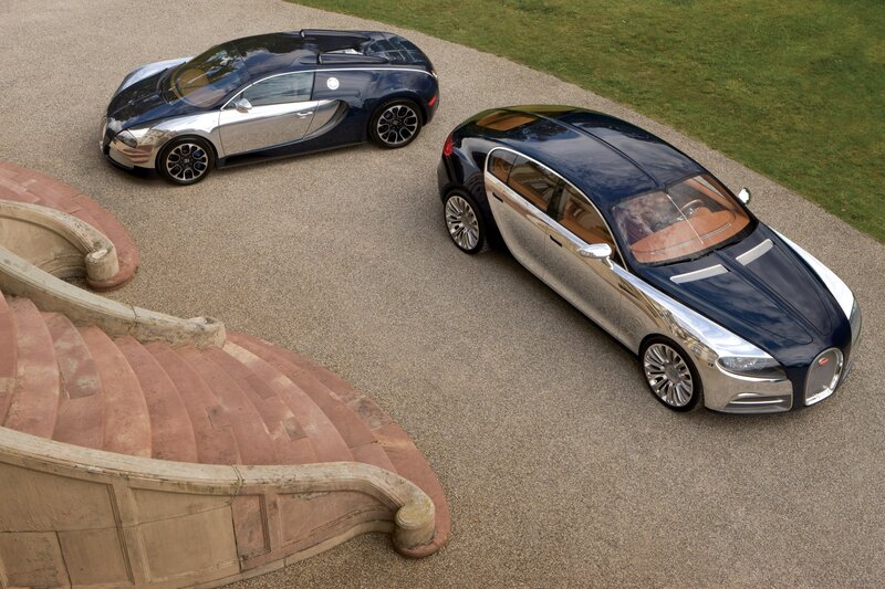 Two Bugatti concept cars on a driveway