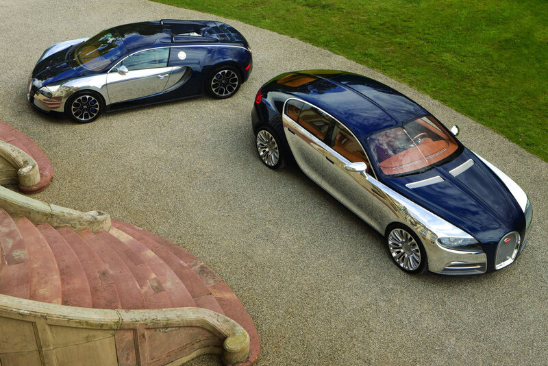 Two Bugatti concept cars on gravel