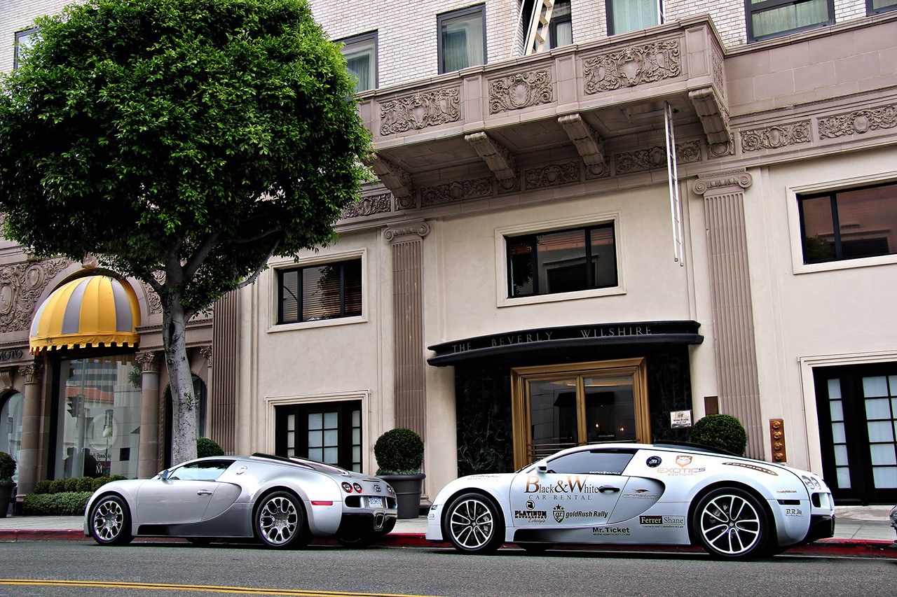Two Bugatti Veyrons outside a hotel