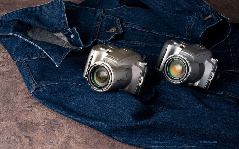 Two cameras on denim jacket