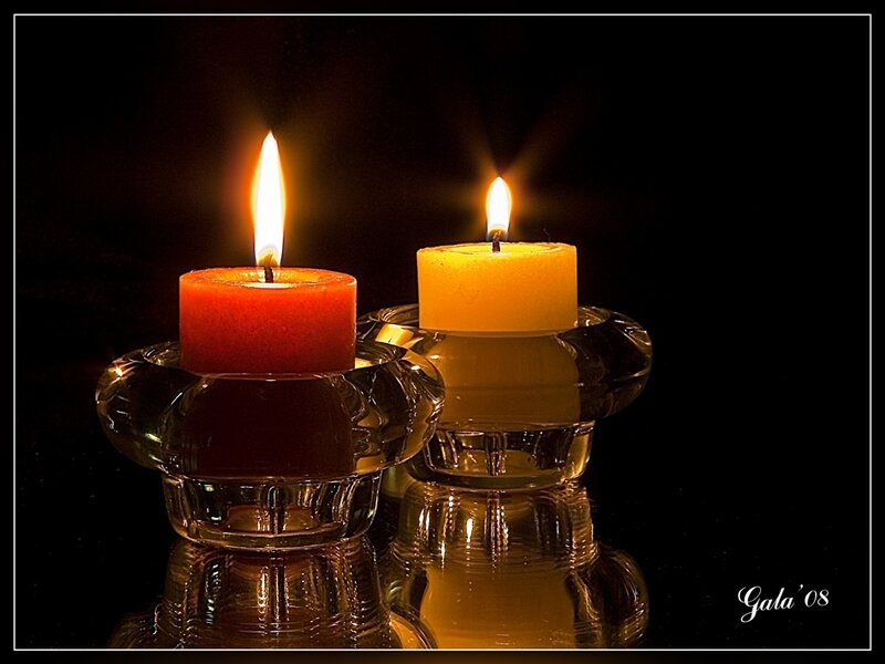 Two candles in glass holders