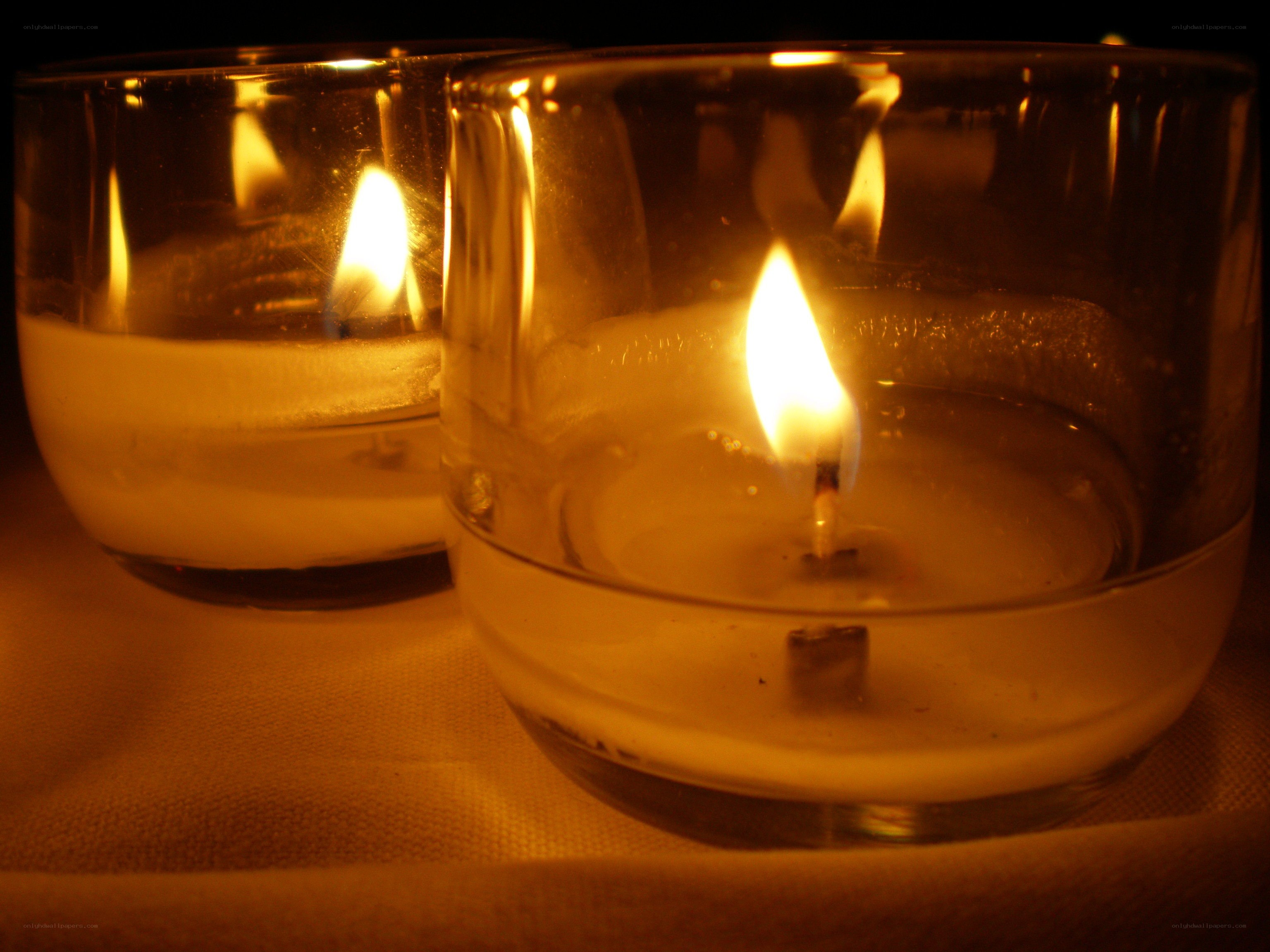 Two candles in glass holders