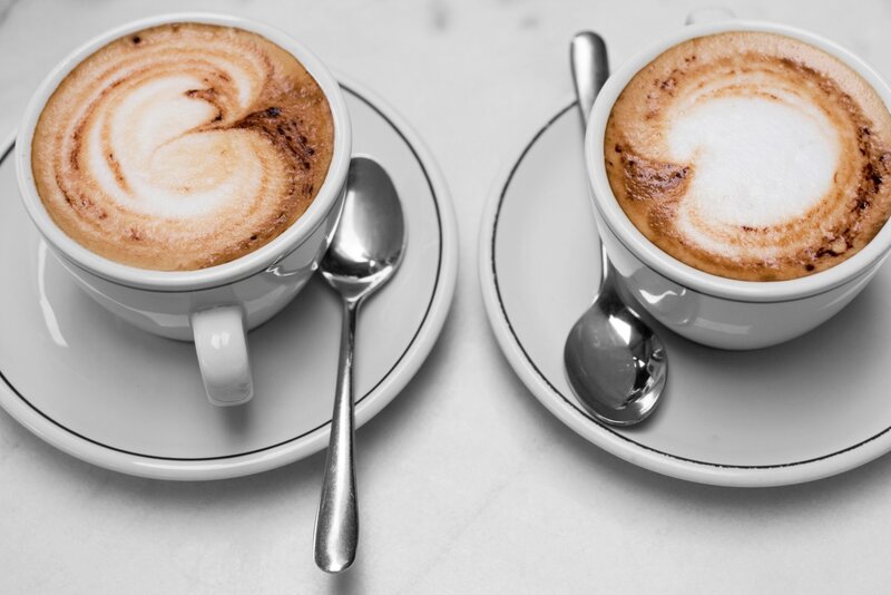 Two Cappuccinos on Saucers