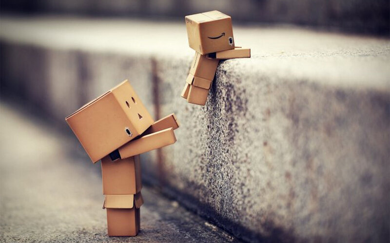 Two cardboard box figures