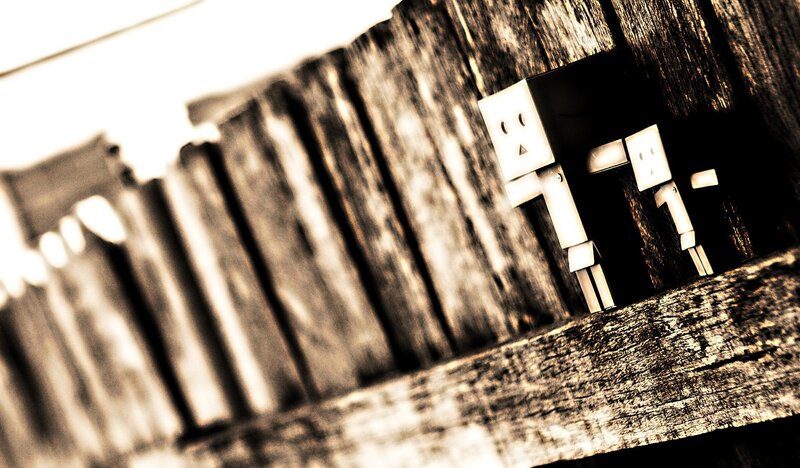 Two Cardboard Figures — Brown, Dramatic, Photograph