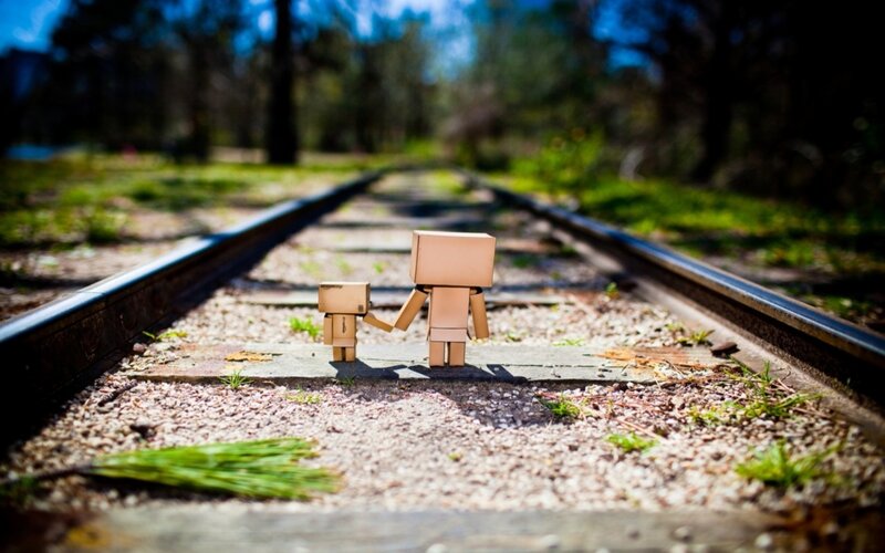 Two Cardboard Figures — Brown, Serene, Afternoon