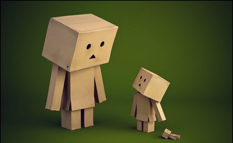 Two cardboard figures standing