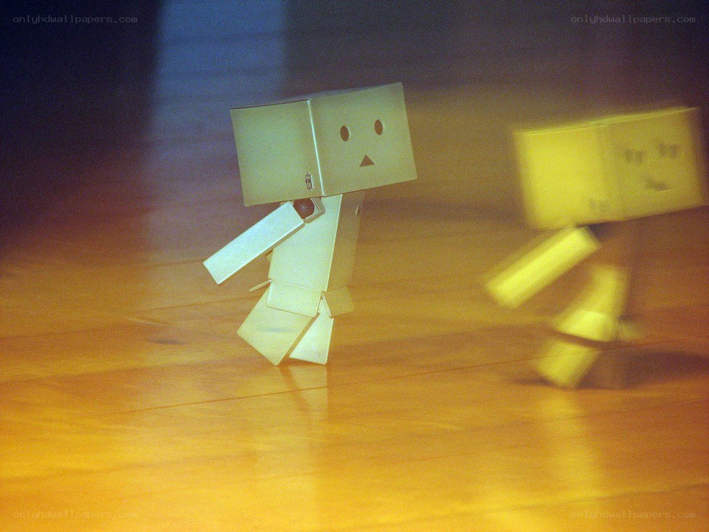 Two cardboard figures walking