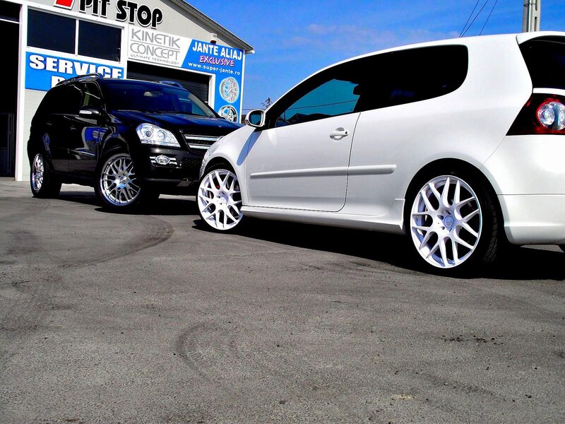 Two cars at a service center