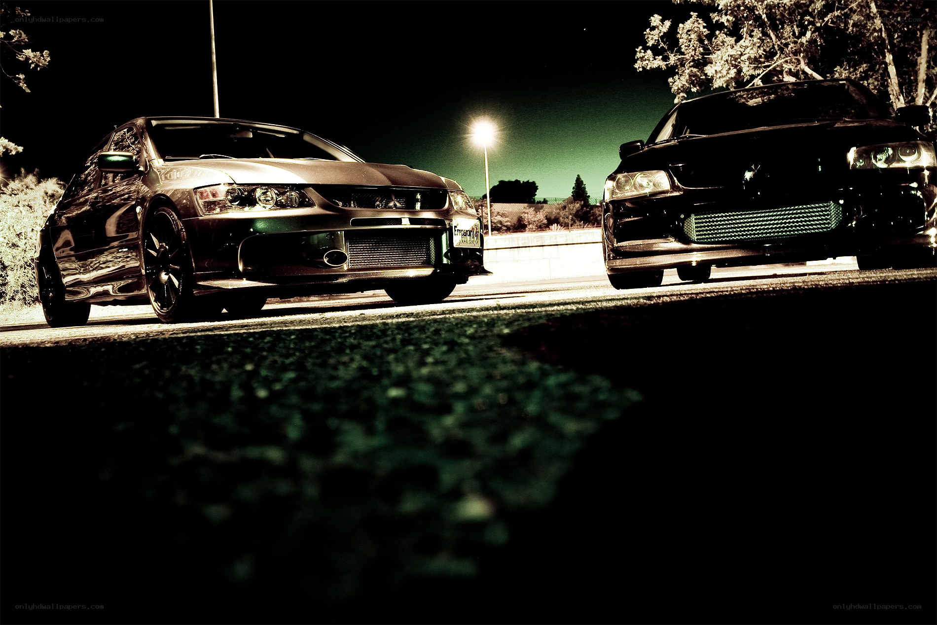Two cars at night