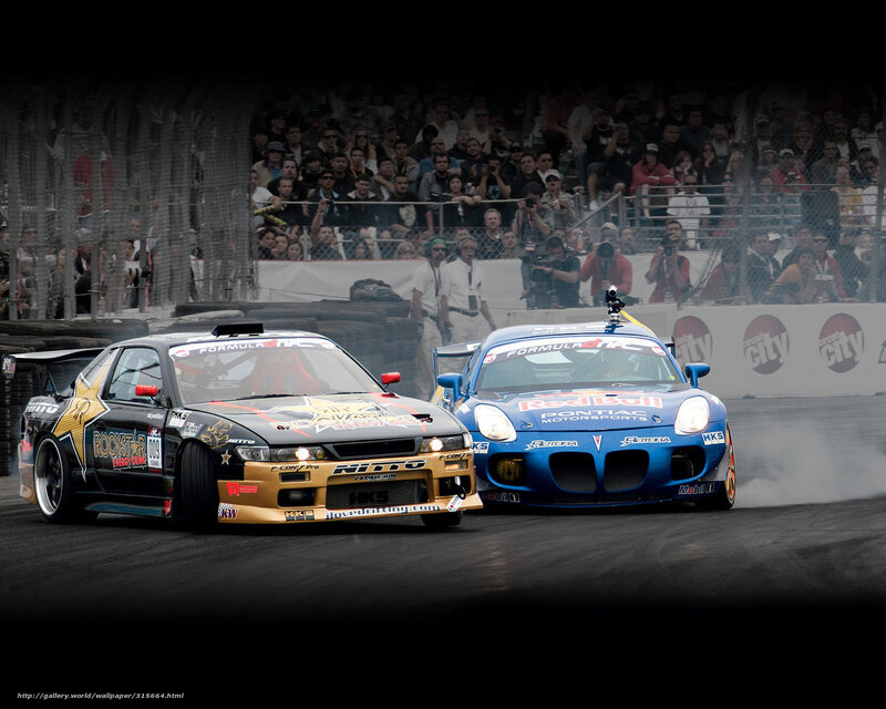 Two cars drifting at a race