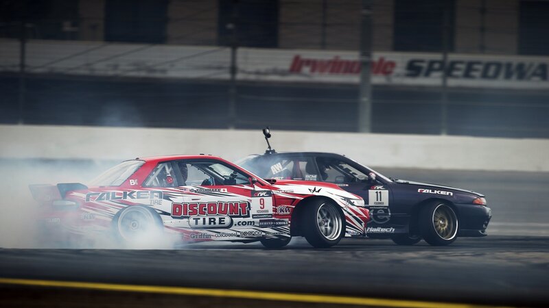 Two cars drifting at Irwindale Speedway