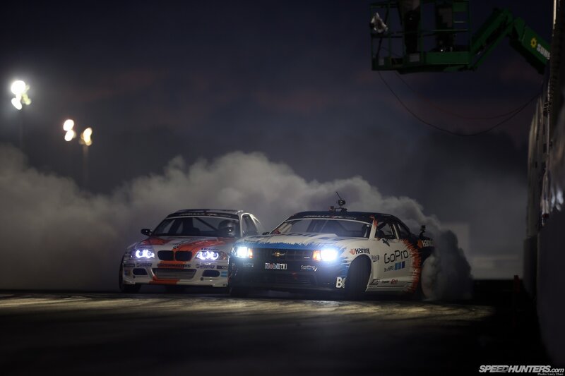 Two cars drifting at night