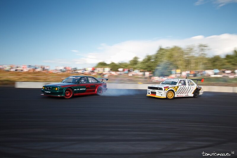 Two Cars Drifting — Black, Dynamic, Afternoon, Photograph, Race Track, Spectators